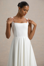 Parina – Robe mi-longue blanche à bretelles et ourlet volumineux Robes de mariée courtes The Wedding Explorer