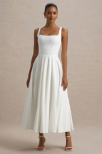 Parina – Robe mi-longue blanche à bretelles et ourlet volumineux Robes de mariée courtes The Wedding Explorer